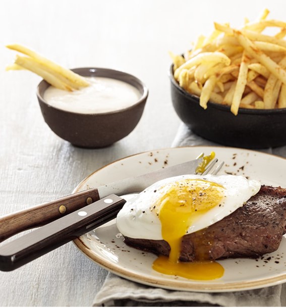 Steak and Egg with Golden Fries and a Garlic Mayonnaise Topping - DRC